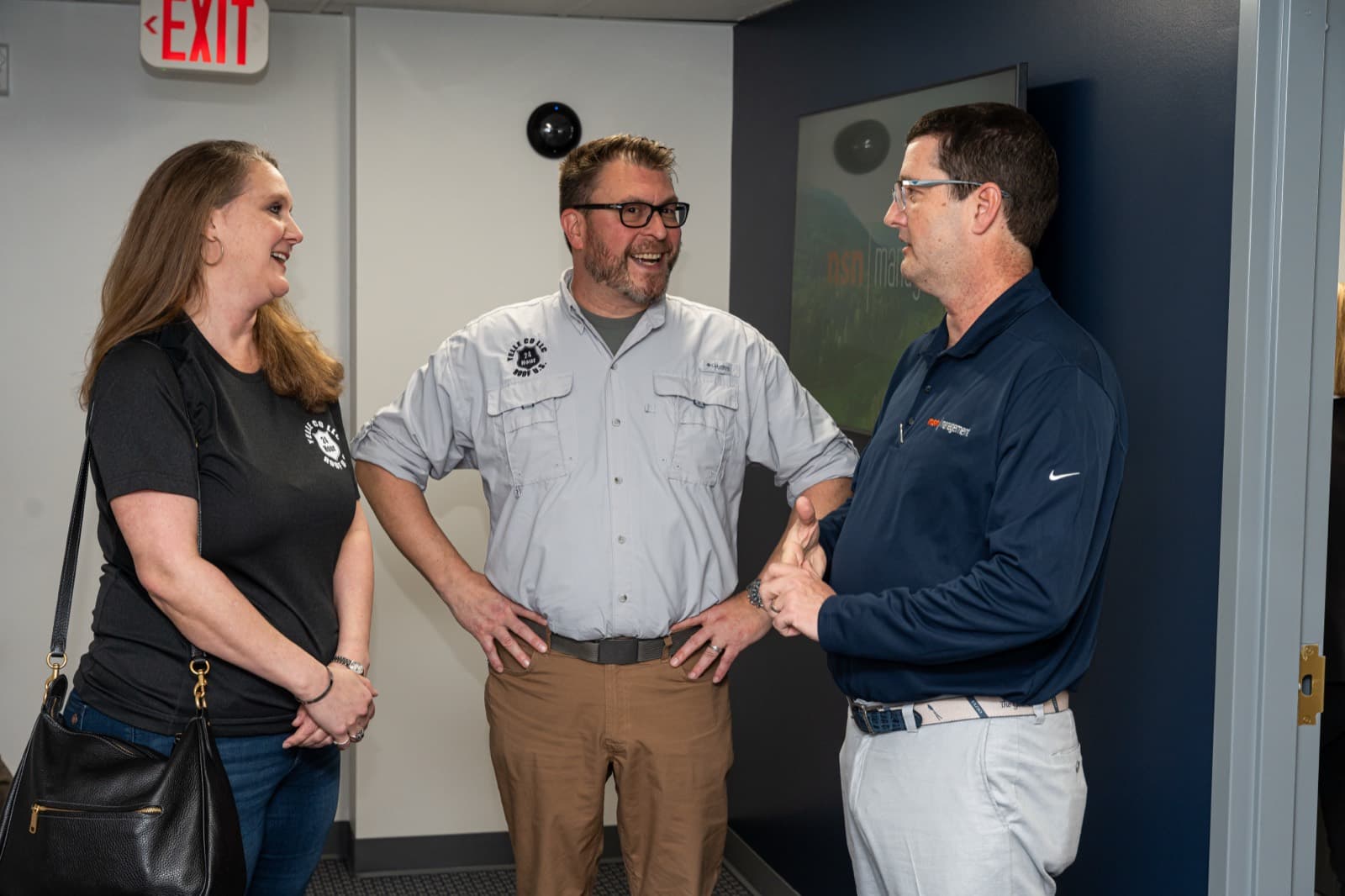 A conversation in the hallway at the NSN Management office